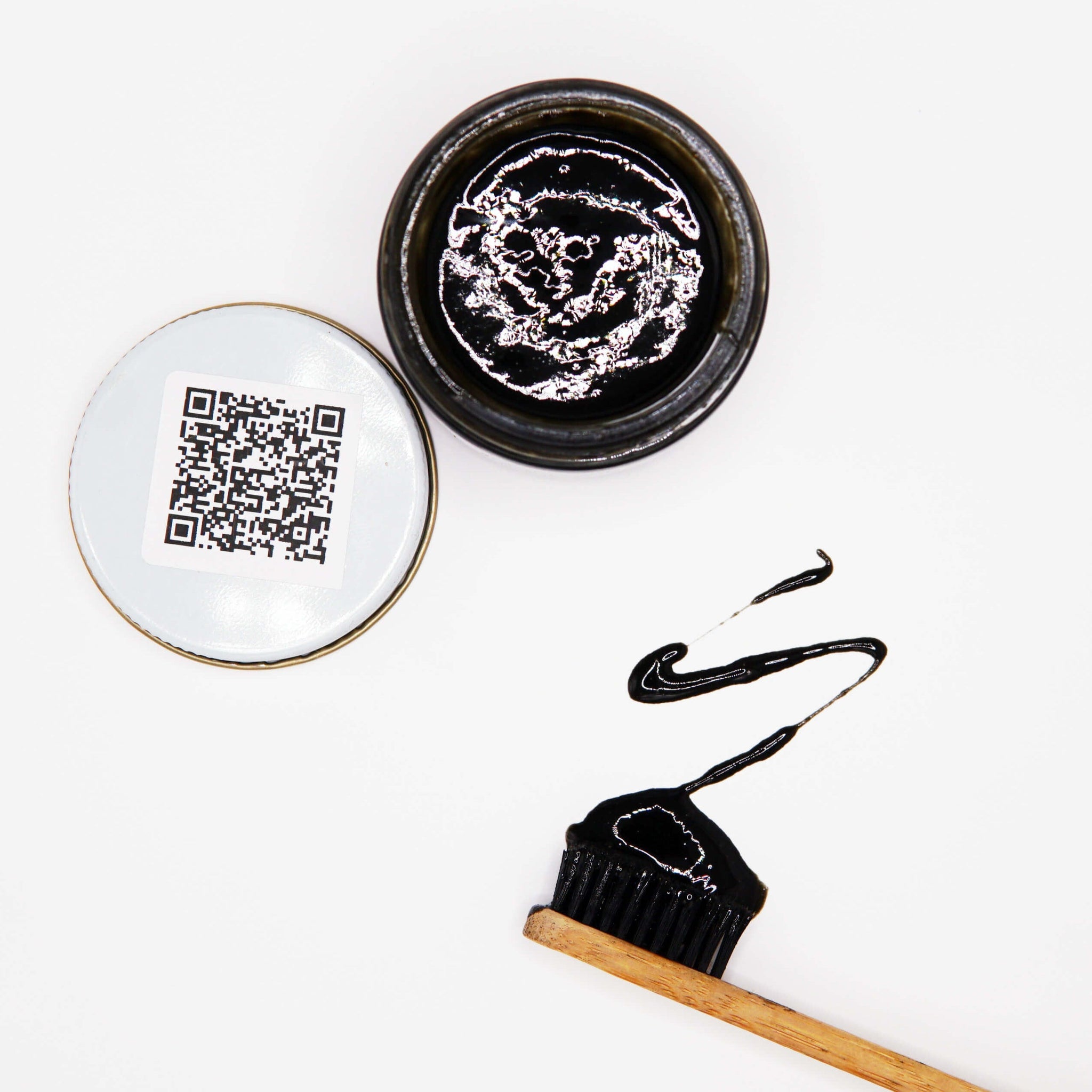 Natural home made toothpaste with charcoal xylitol baking soda and hydroxyapatite