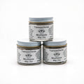 Three stacked 60g jars of TranscenDental nano-hydroxyapatite toothpaste